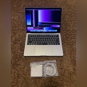 2019 Apple MacBook Pro laptop computer with Touch Bar, Touch ID And Logic Pro X